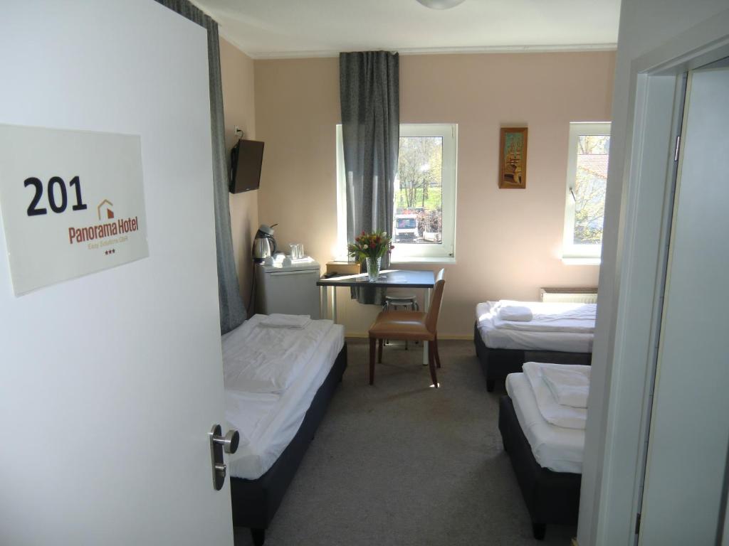 Postel nebo postele na pokoji v ubytování Panorama Hotel Frankfurt Offenbach Süd