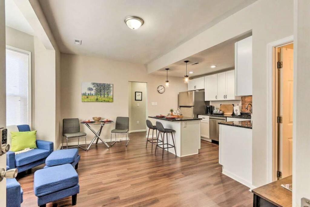 a kitchen and living room with a couch and a table at Newly Renovated, Quaint, Modern 2-Bedroom Loft in Front Royal