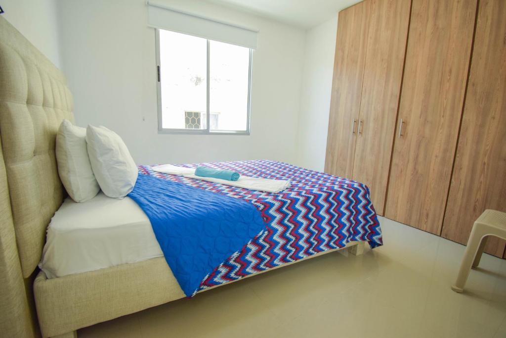 Postel nebo postele na pokoji v ubytování Ayenda Ceiba Rooms