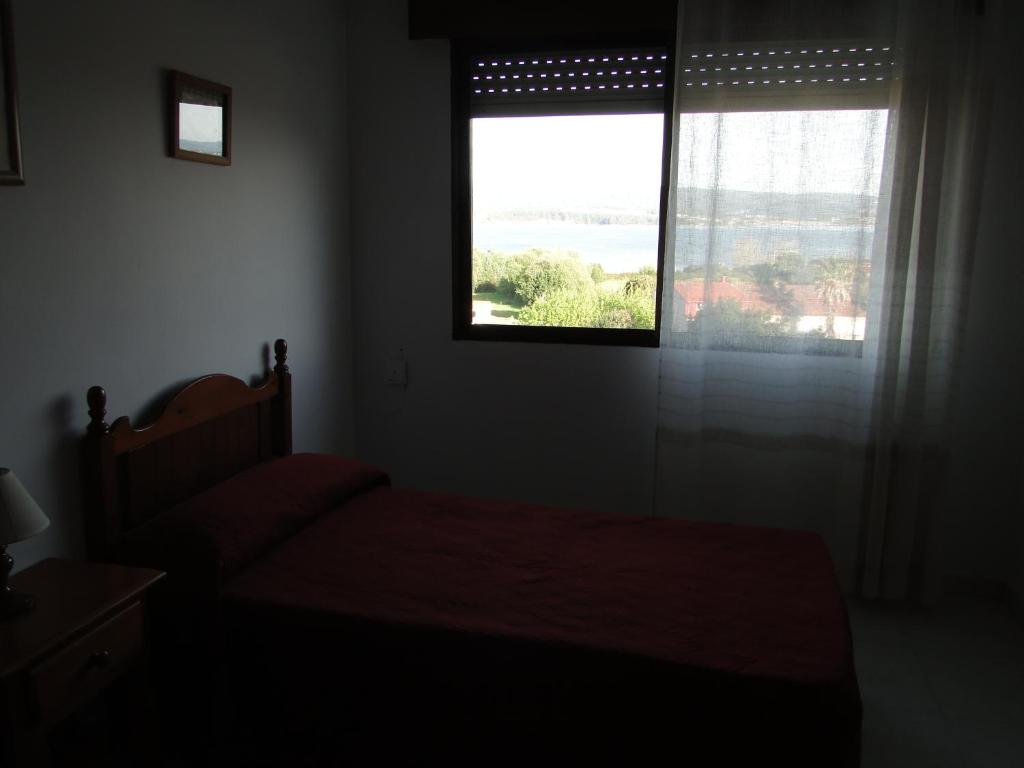 Posteľ alebo postele v izbe v ubytovaní Apartamentos Blanco