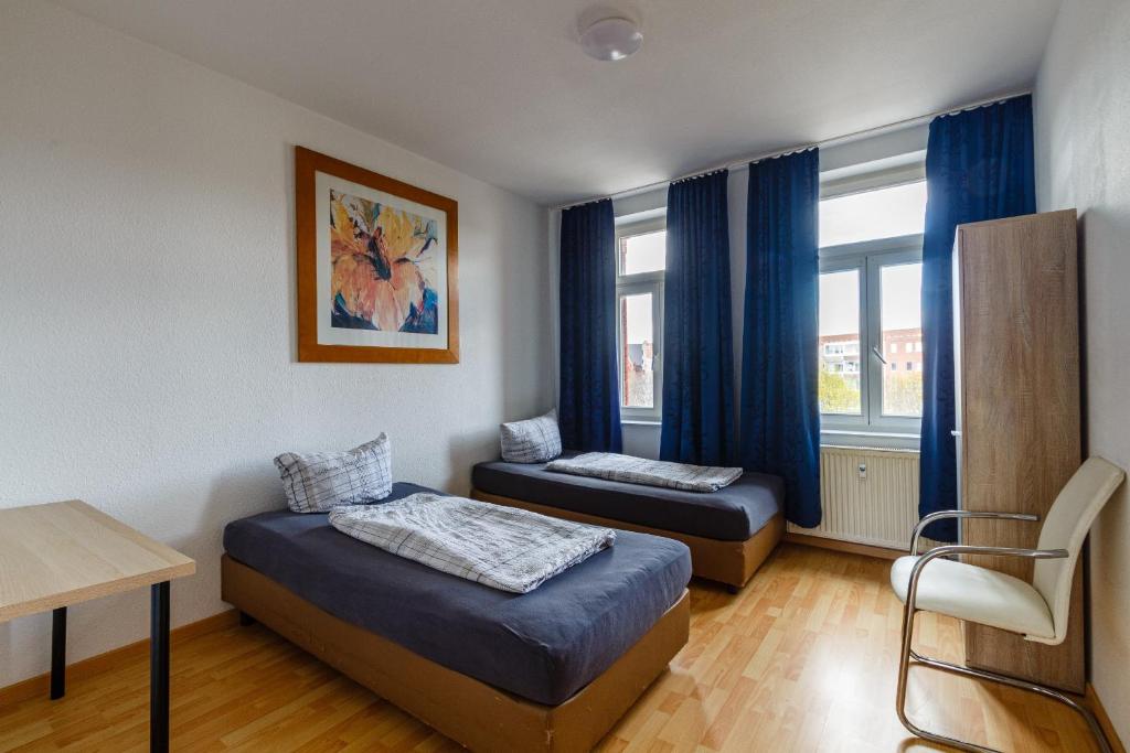 เตียงในห้องที่ Monteurwohnung in Leipzig