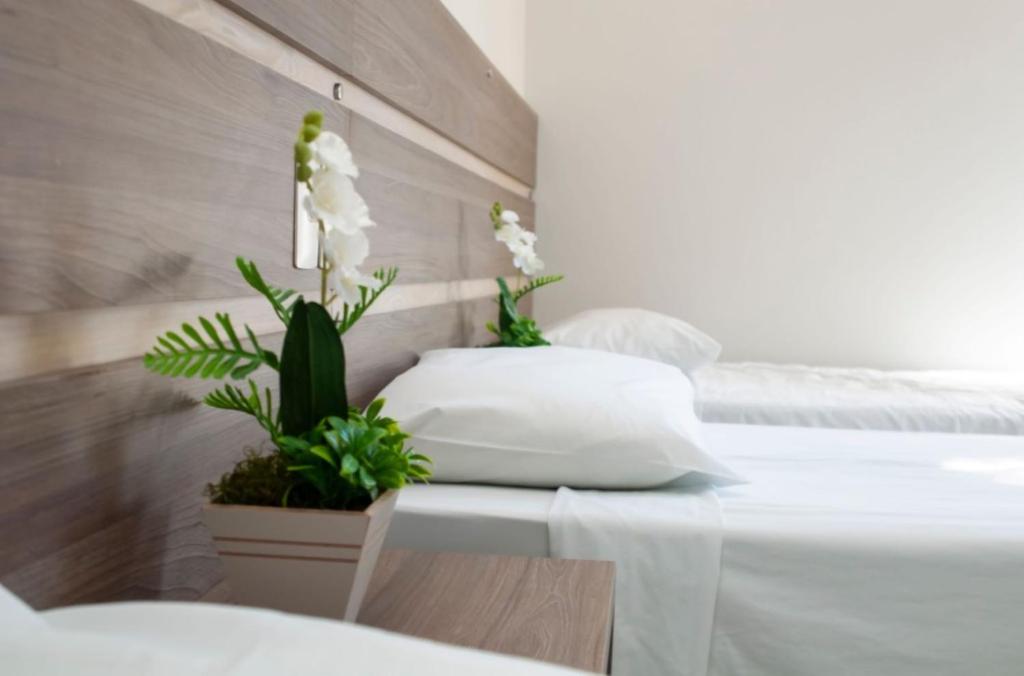 Postel nebo postele na pokoji v ubytování SMART IGUASSU HOTEL