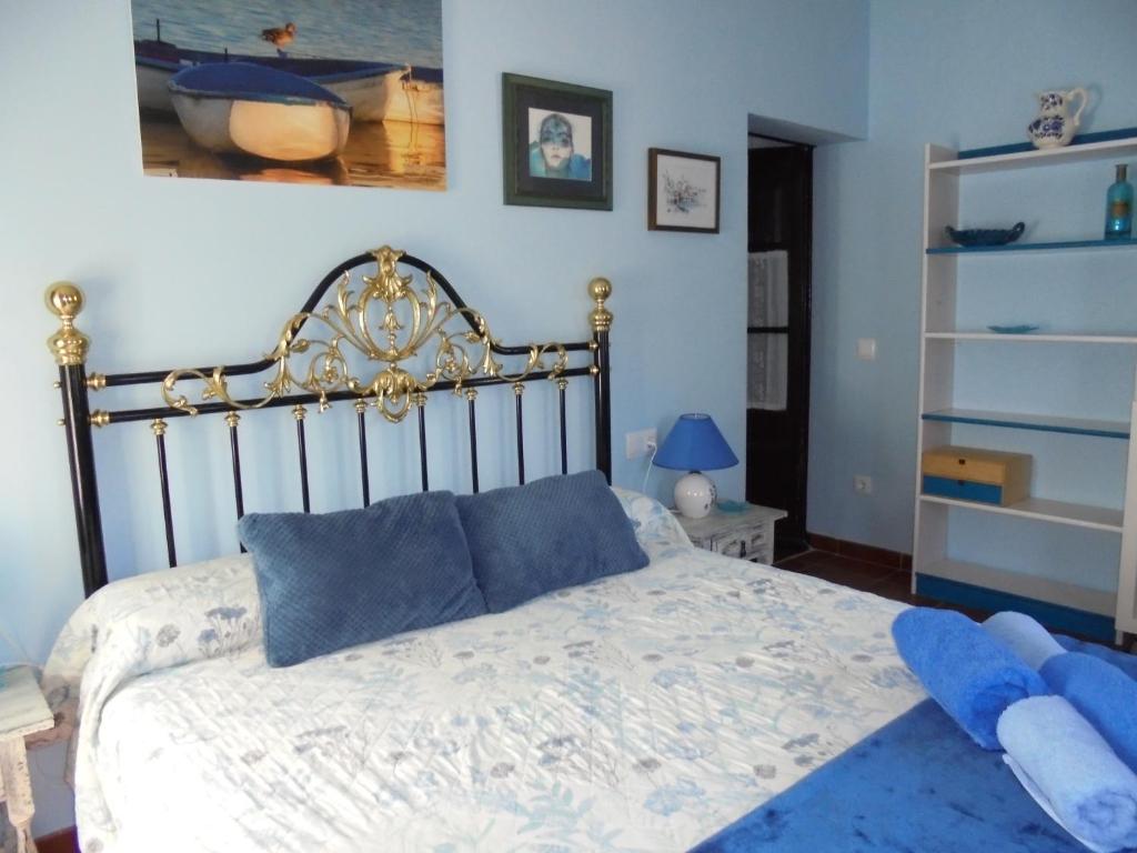 A bed or beds in a room at Casa rural Cal Fuster Experience