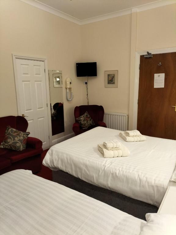 Postel nebo postele na pokoji v ubytování Viking Hotel