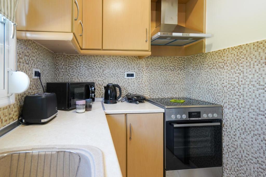 Kuchyňa alebo kuchynka v ubytovaní Kyriakos Apartment