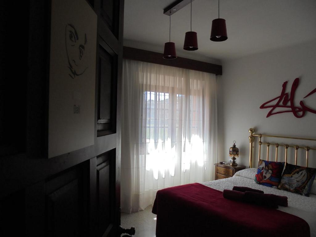 A bed or beds in a room at Casa rural Cal Fuster Experience
