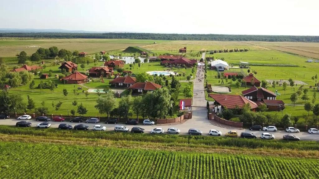 an aerial view of a village with cars parked in a parking lot at Krašograd in Pisarovina