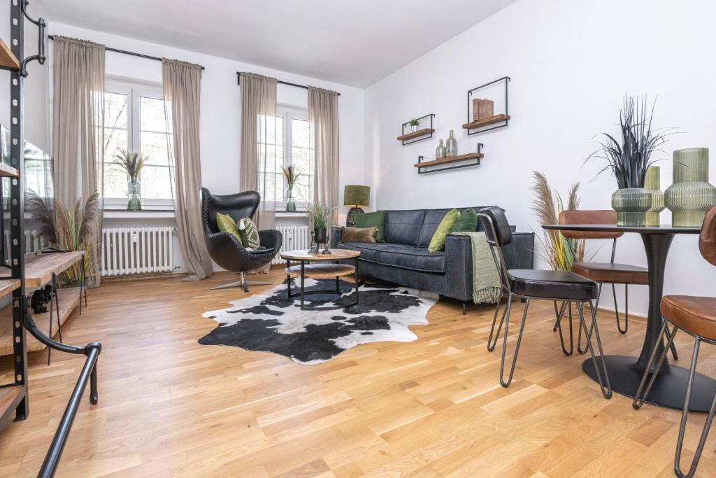 a living room with a couch and a table at Center Dream Apartment - Netflix in Krefeld