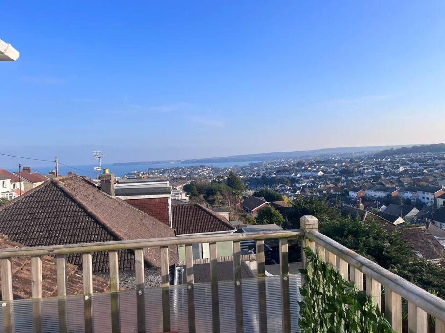 a view of a city from a balcony of a house at Bay View Retreat in Paignton