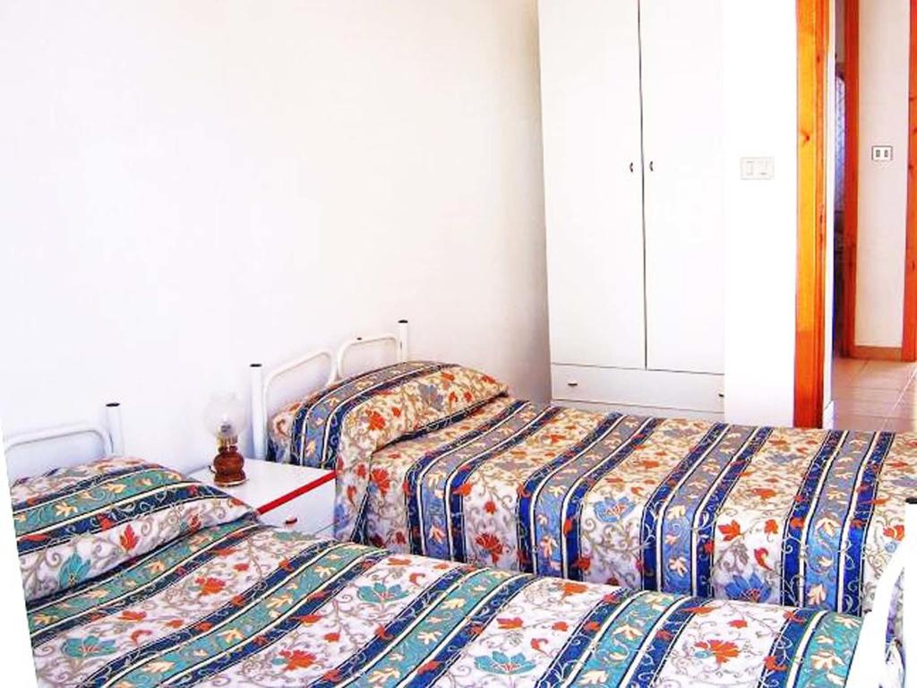 Postel nebo postele na pokoji v ubytování Villa Emidio
