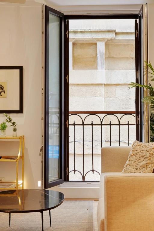A bed or beds in a room at 8 balconies Heart of the old town
