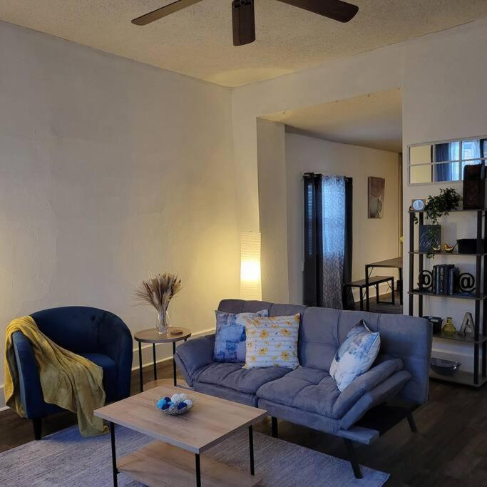 a living room with a blue couch and a table at Central 1 Bd in Fountain Square- Walk 5 Min to Downtown in Indianapolis