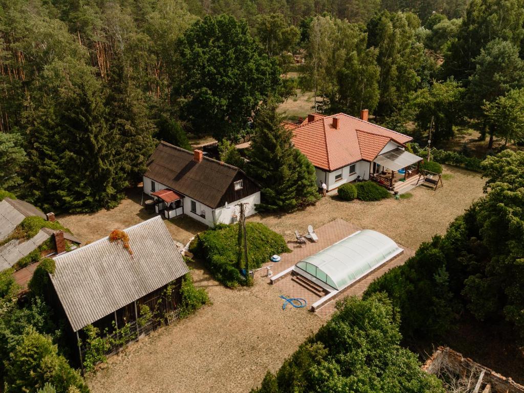 an aerial view of a house with a swimming pool at Kwintesencja Natury in Stobnicko