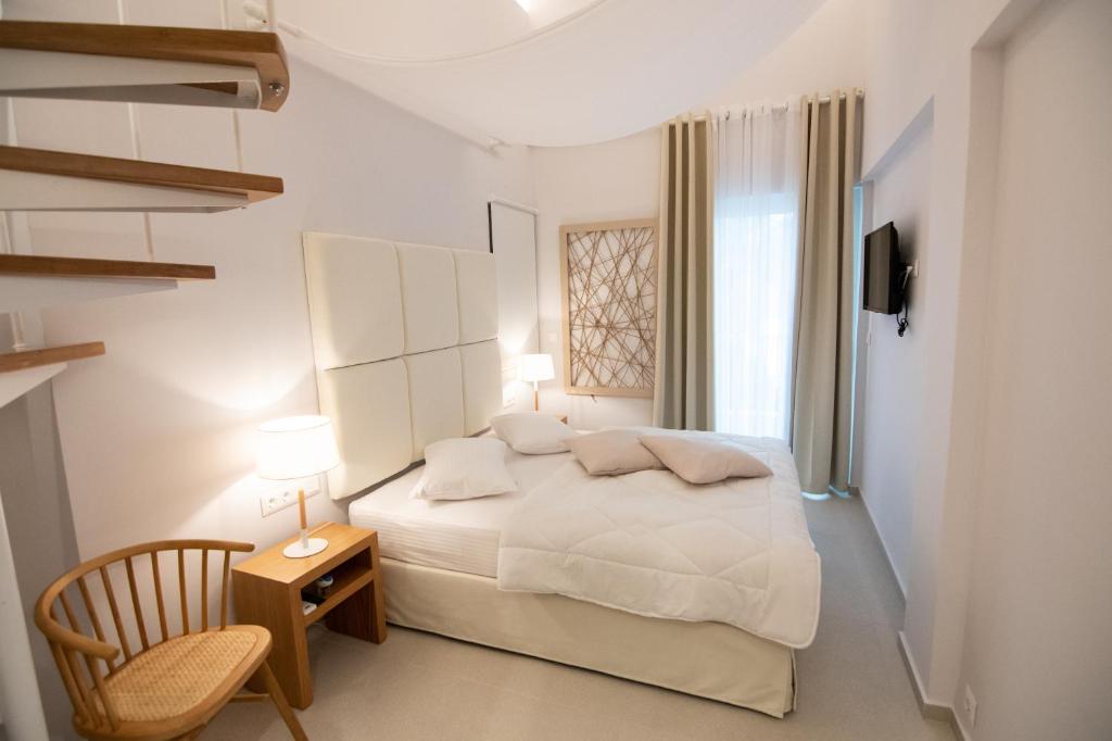 Posteľ alebo postele v izbe v ubytovaní Dimani Suites