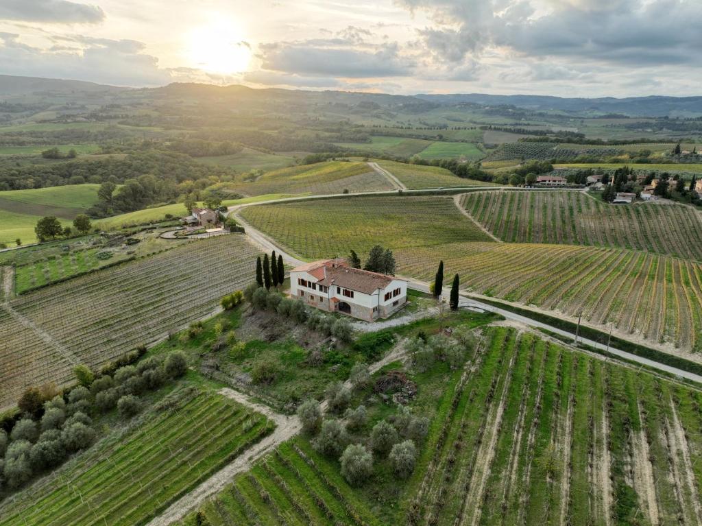 an aerial view of a house in the middle of a field at Podere La Quercia in San Gimignano