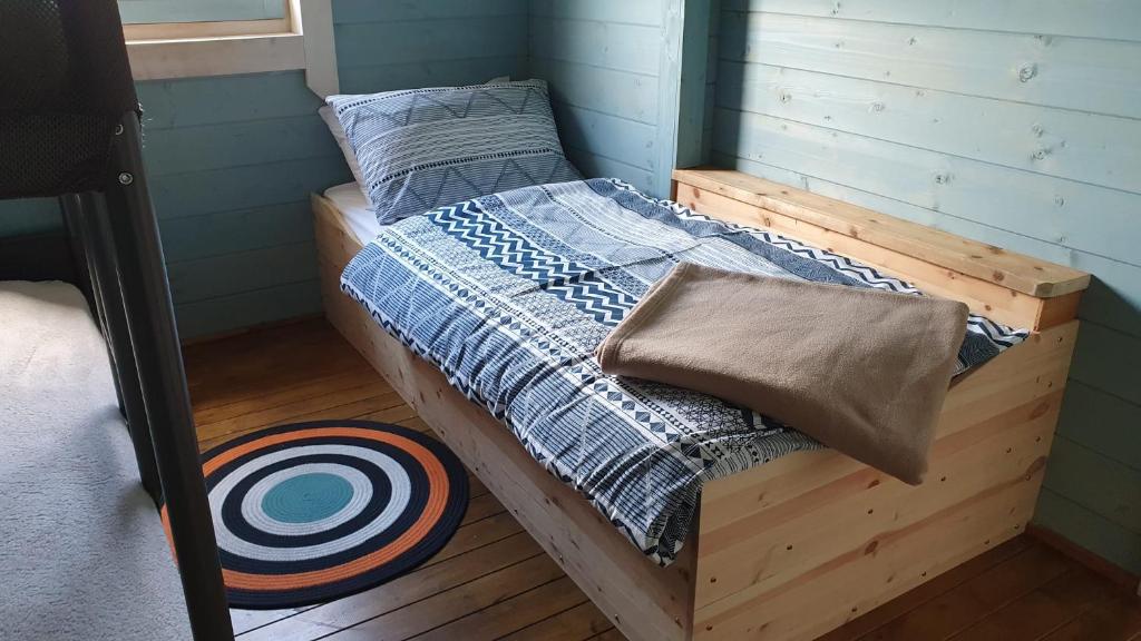 a bedroom with a wooden bunk bed with a target at Pure Space in Kilkee