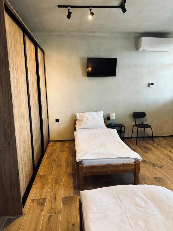 A bed or beds in a room at Kerkira pub&restaurant