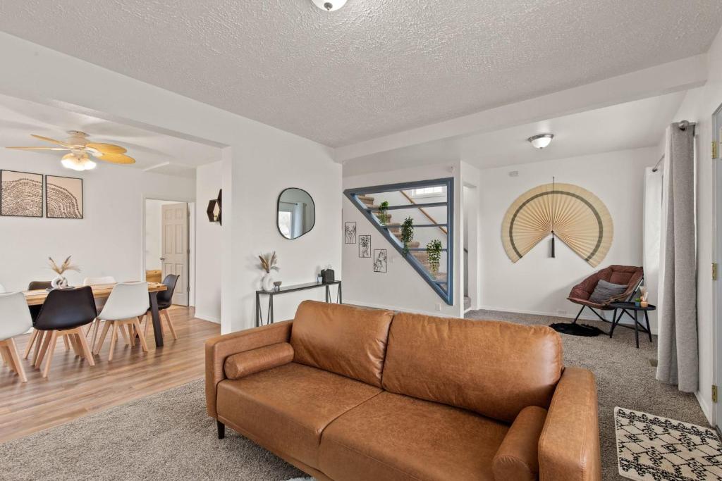 a living room with a couch and a dining room at New! Charming 3 bedroom home with HOT-TUB! in Spokane