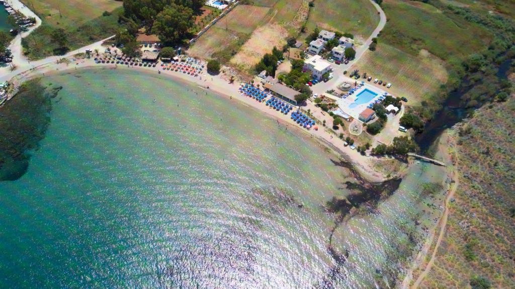 an aerial view of a beach with a crowd of people at KALIVAKI in Georgioupolis