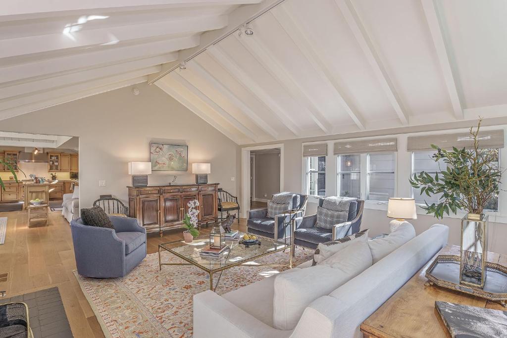 a living room with a white couch and chairs at 3884 Twenty-One Oaks home in Carmel