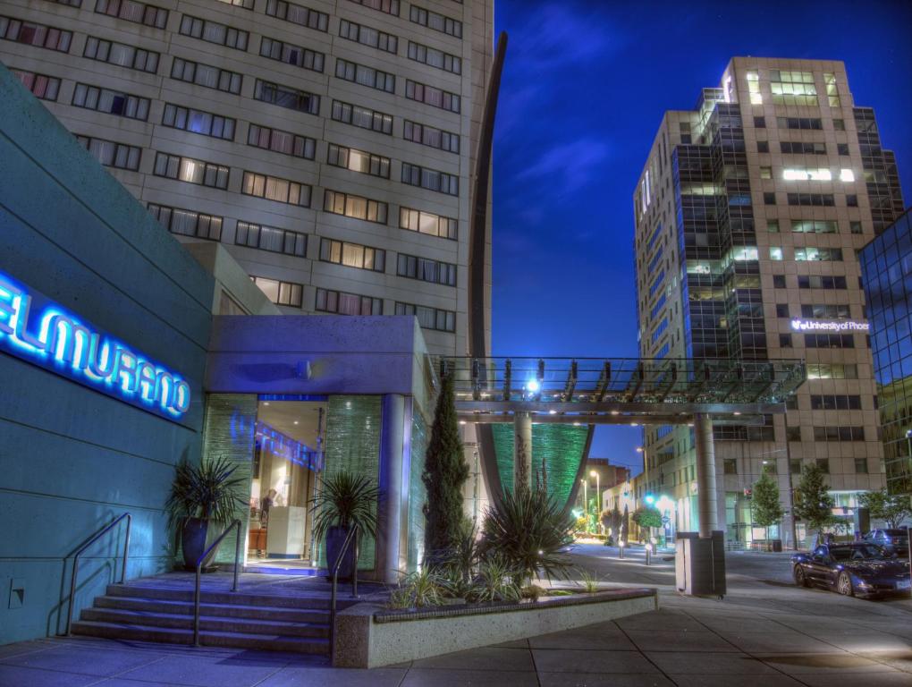 a building with a walkway in a city at night at Hotel Murano in Tacoma