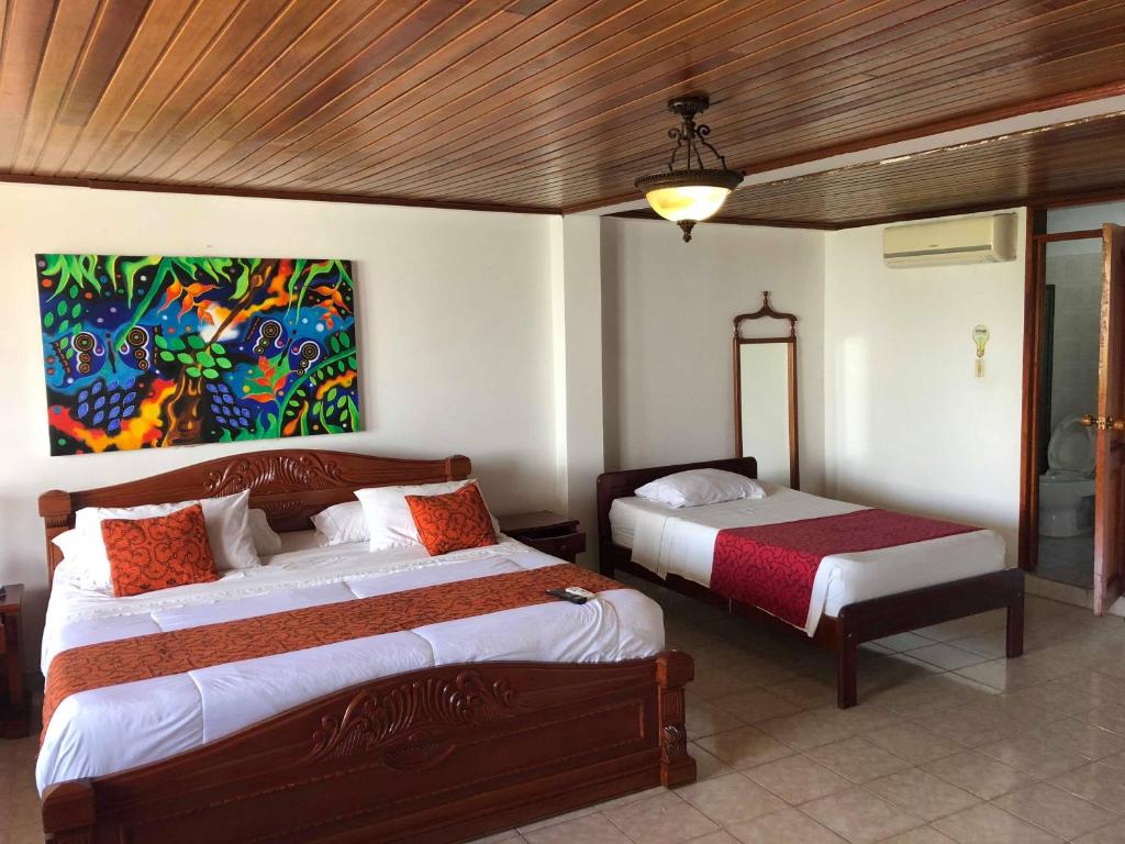 Postel nebo postele na pokoji v ubytování Hotel Yurupary AMAZONAS
