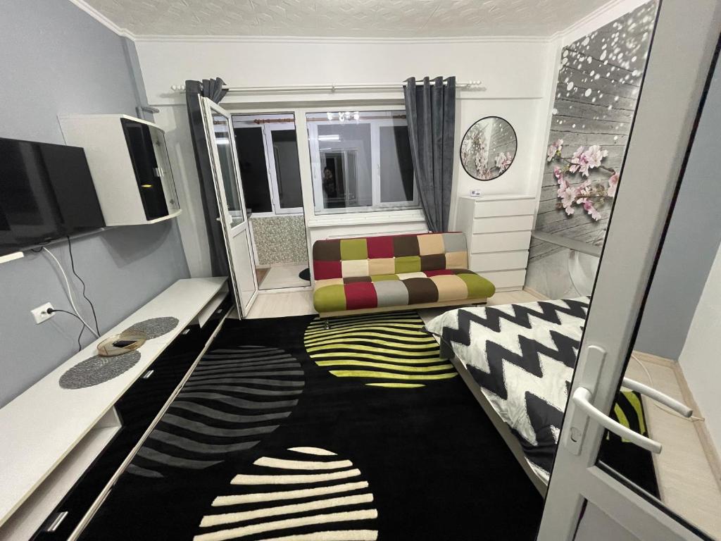 TV a/nebo společenská místnost v ubytování CENTRAL Colors Studio Petrosani