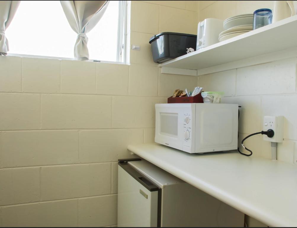 Kuchyň nebo kuchyňský kout v ubytování Alpha Motor Inn