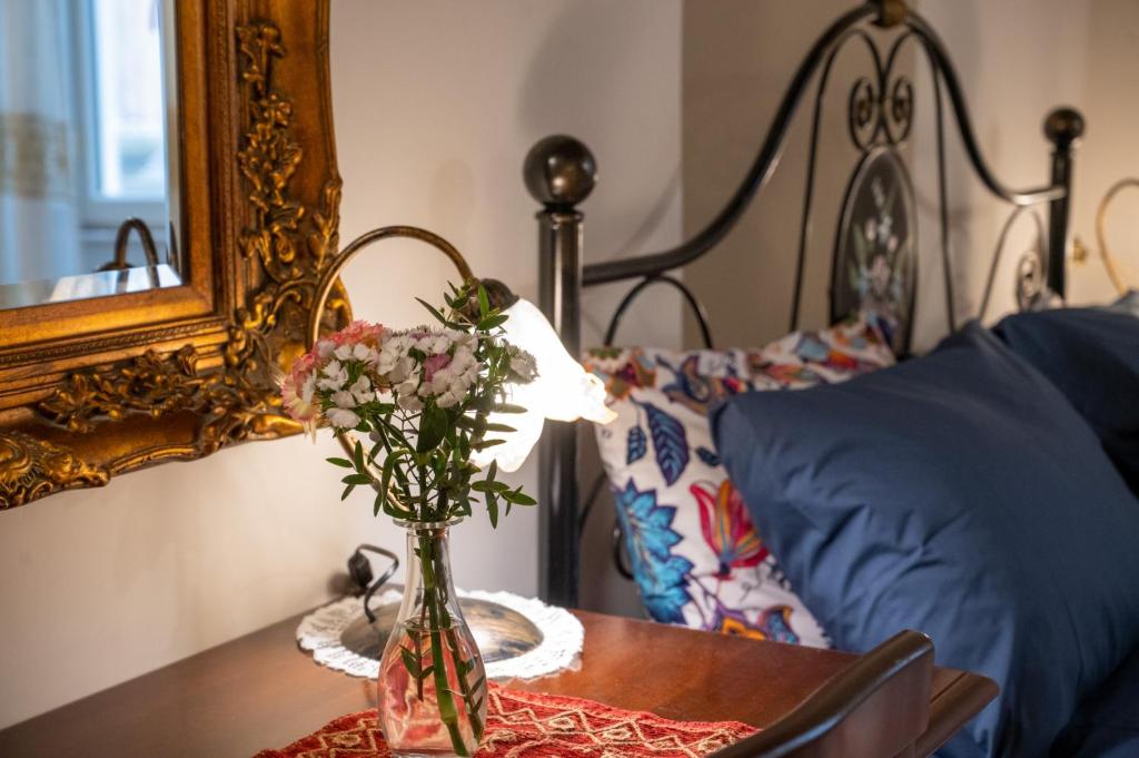 Postel nebo postele na pokoji v ubytování Corcioli B&B