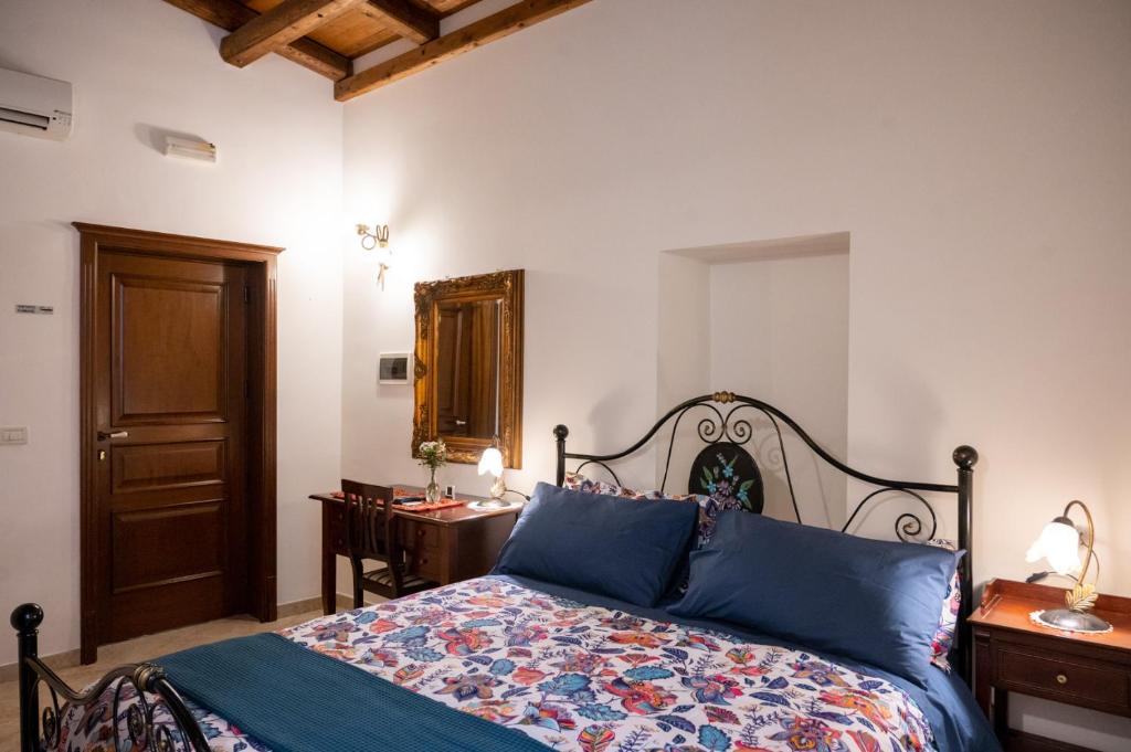 Postel nebo postele na pokoji v ubytování Corcioli B&B