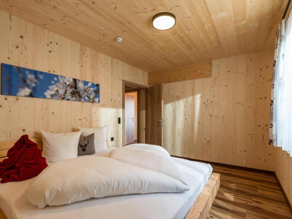 Postel nebo postele na pokoji v ubytování Alpenchalets Oberlaiming