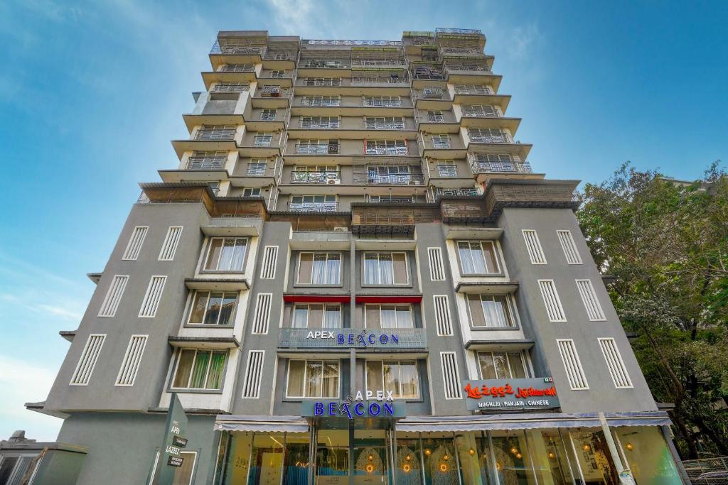 a tall gray building with a lot of windows at Apex Beacon Hotel, Mumbai in Mumbai