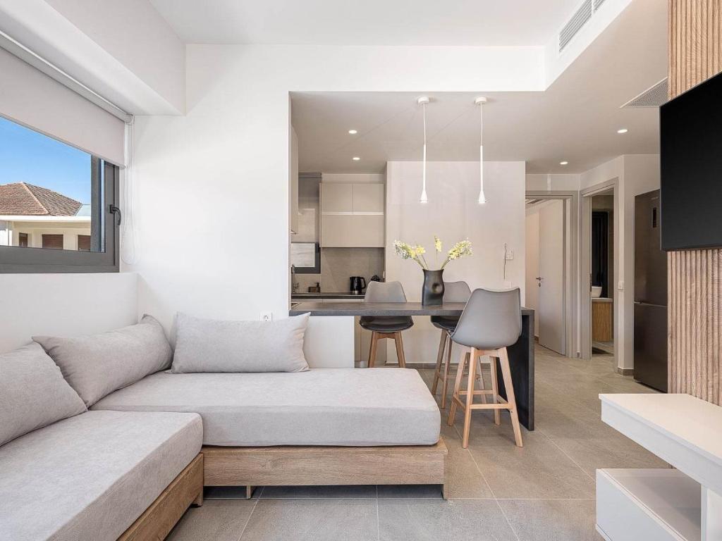 a living room with a couch and a table at Casa D'Irene Apts in Chania Town