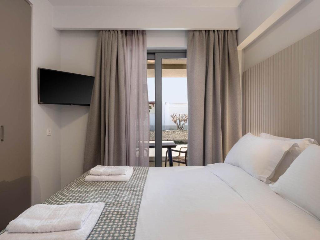A bed or beds in a room at Casa D'Irene Apts