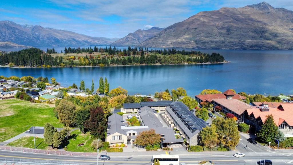 an aerial view of a town next to a lake at Garden Court Suites & Apartments in Queenstown