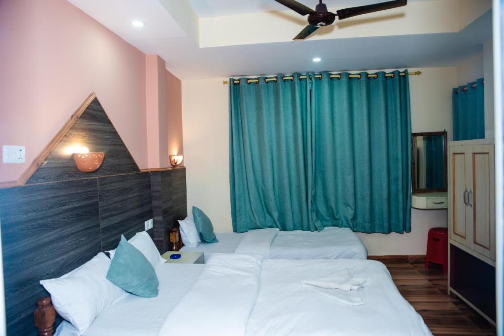 Cama o camas de una habitación en Hotel Olympus Pokhara