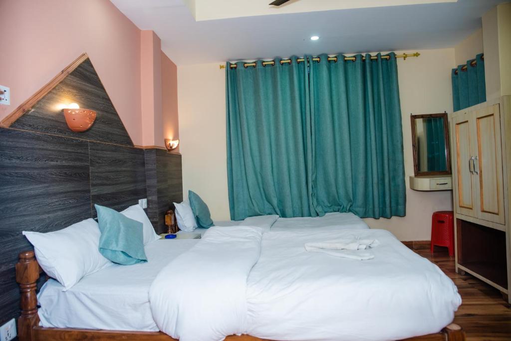 Cama o camas de una habitación en Hotel Olympus Pokhara