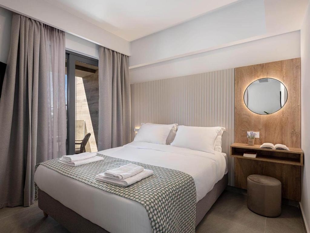 A bed or beds in a room at Casa D'Irene Apts