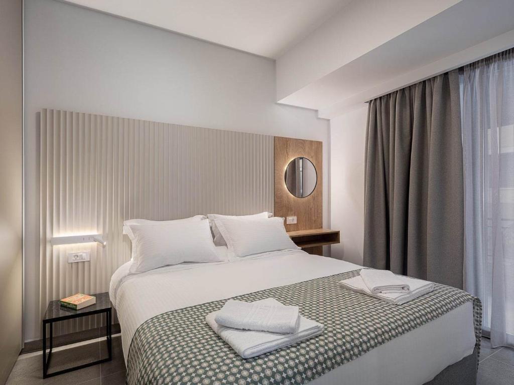 A bed or beds in a room at Casa D'Irene Apts