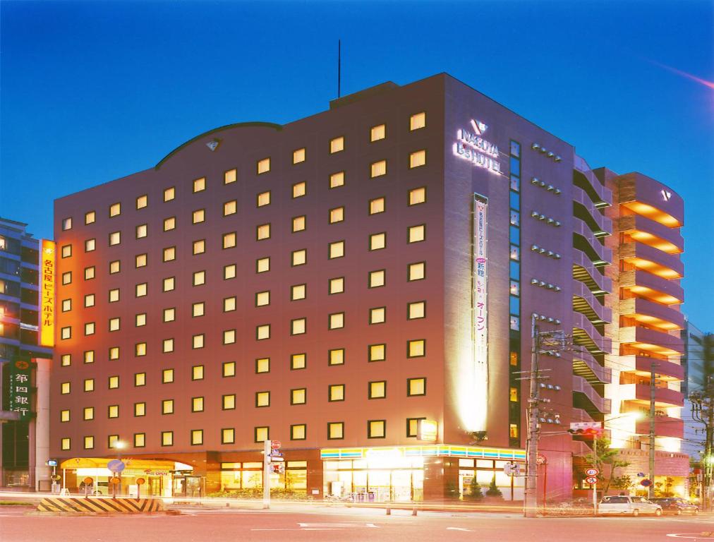 a large building with a sign on the side of it at Nagoya B's Hotel in Nagoya
