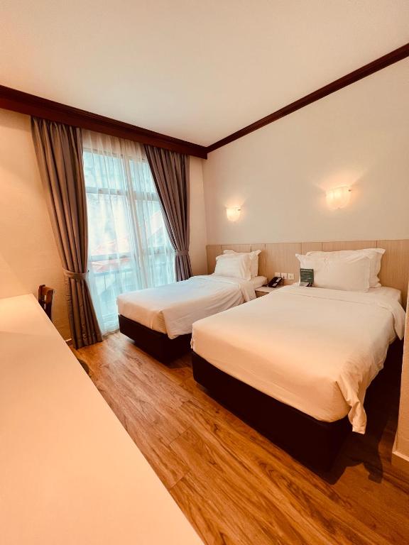 Postel nebo postele na pokoji v ubytování Park View Hotel