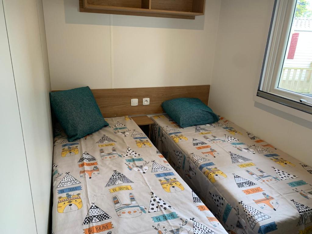 Postel nebo postele na pokoji v ubytování RESPIRE