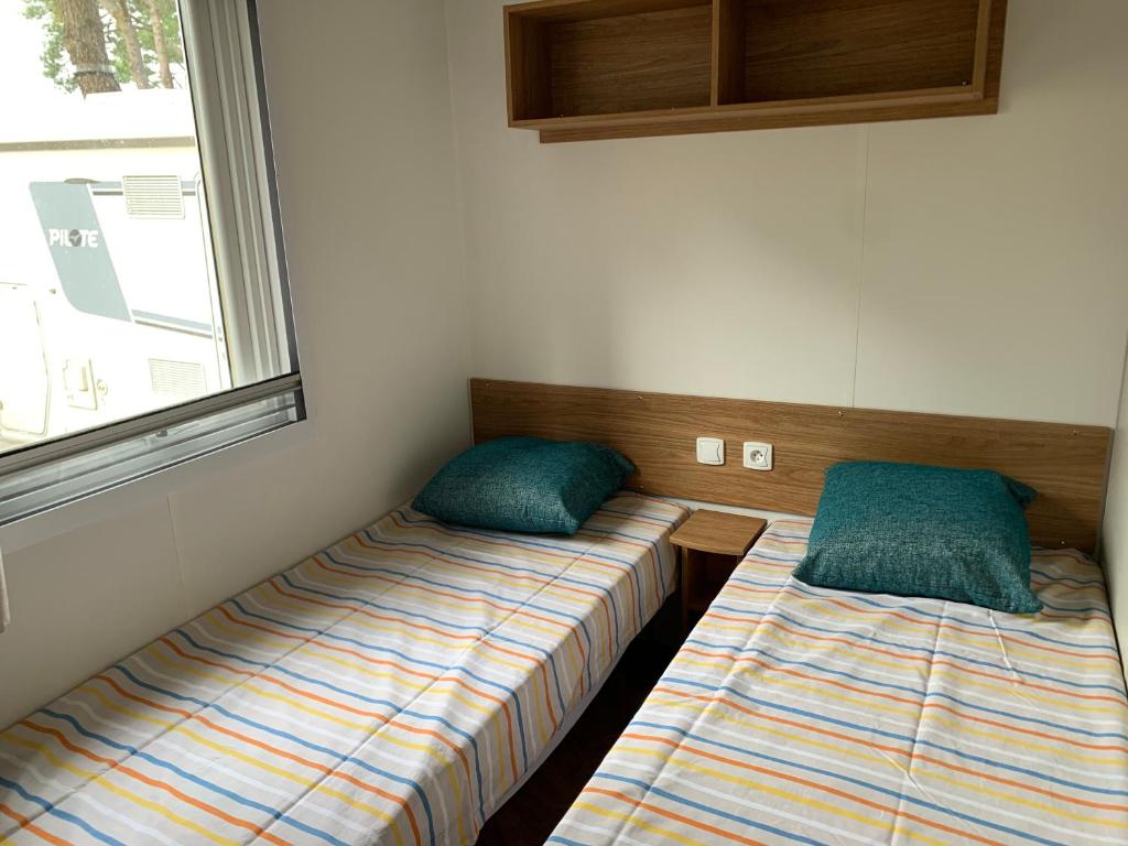 Postel nebo postele na pokoji v ubytování RESPIRE