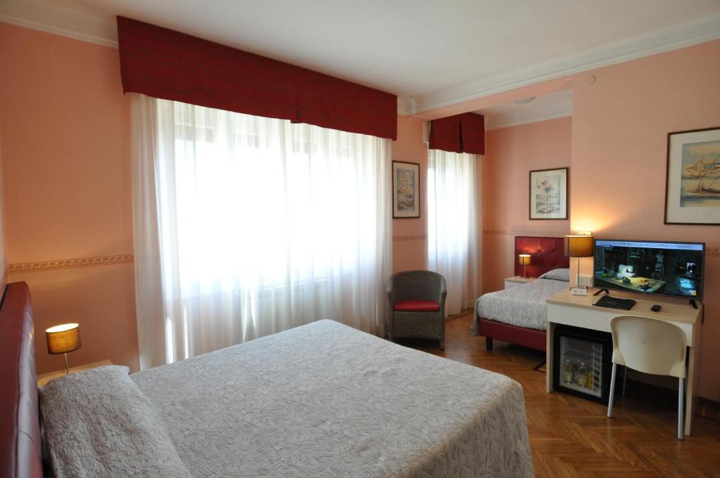 Postel nebo postele na pokoji v ubytování Hotel Sole Mare