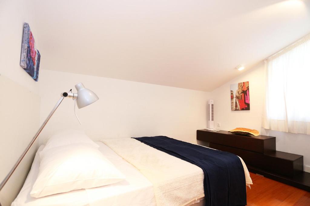 Ein Bett oder Betten in einem Zimmer der Unterkunft Villa Belvedere apartment 4