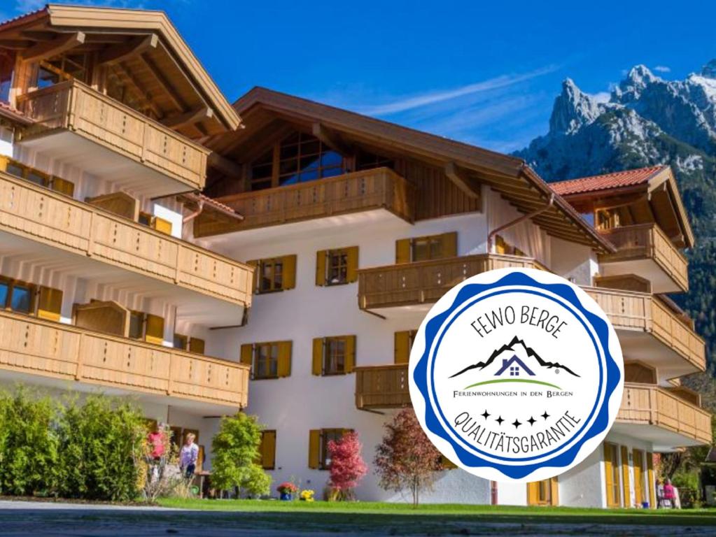 a building with a sign in front of it at Evelyn – Haus Karwendel, Ferienwohnung in Mittenwald