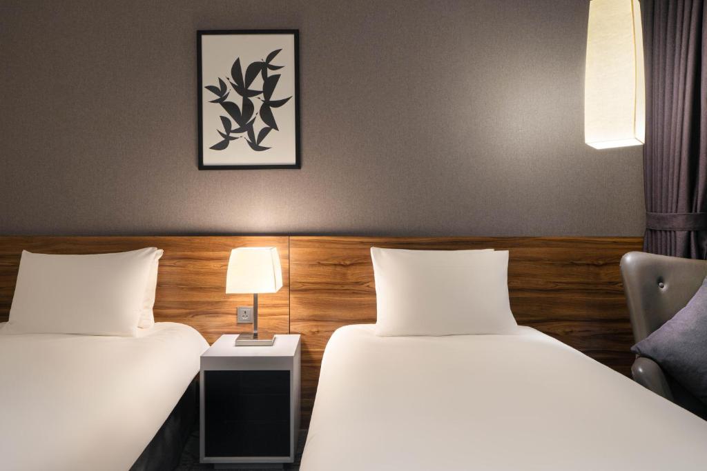 Postel nebo postele na pokoji v ubytování Staz Hotel Ulsan