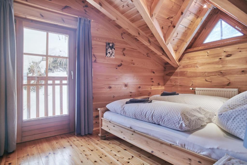 Postel nebo postele na pokoji v ubytování MOUNTAINRANGER - Lodge - ski in & ski out