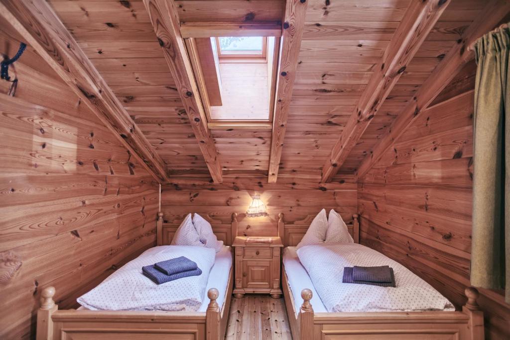 Postel nebo postele na pokoji v ubytování MOUNTAINRANGER - Lodge - ski in & ski out