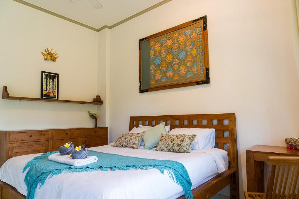 Postel nebo postele na pokoji v ubytování Buddha Homestay